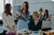A woman demonstrates the vegetable holder component of the Tupperware Mandoline food slicer.