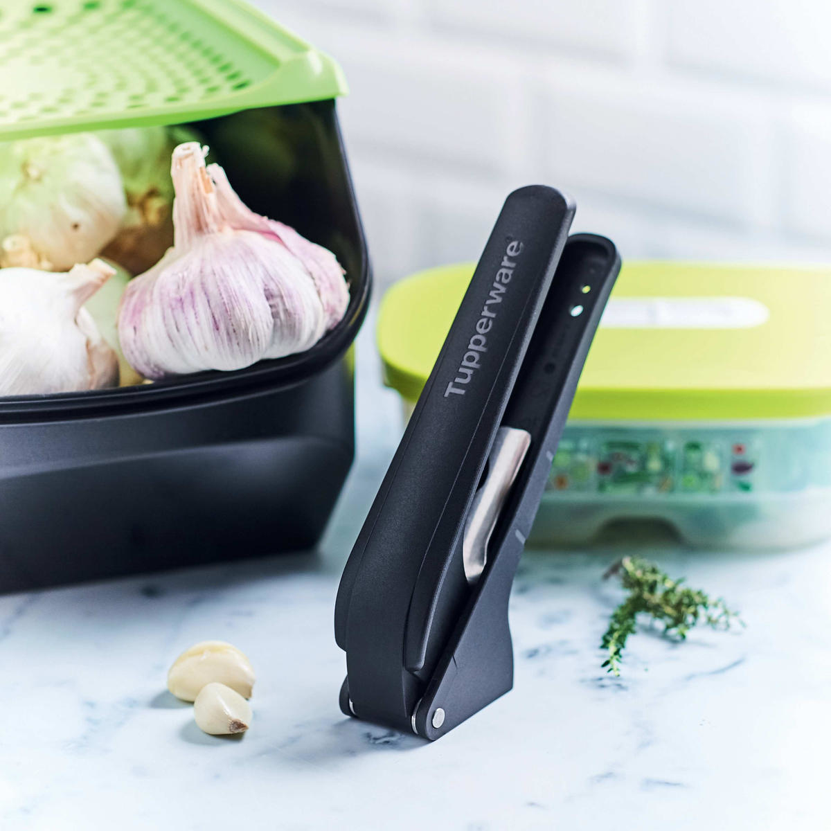 Tupperware® Garlic Press | Peel, Press, Prep Garlic & Fresh Herbs ...